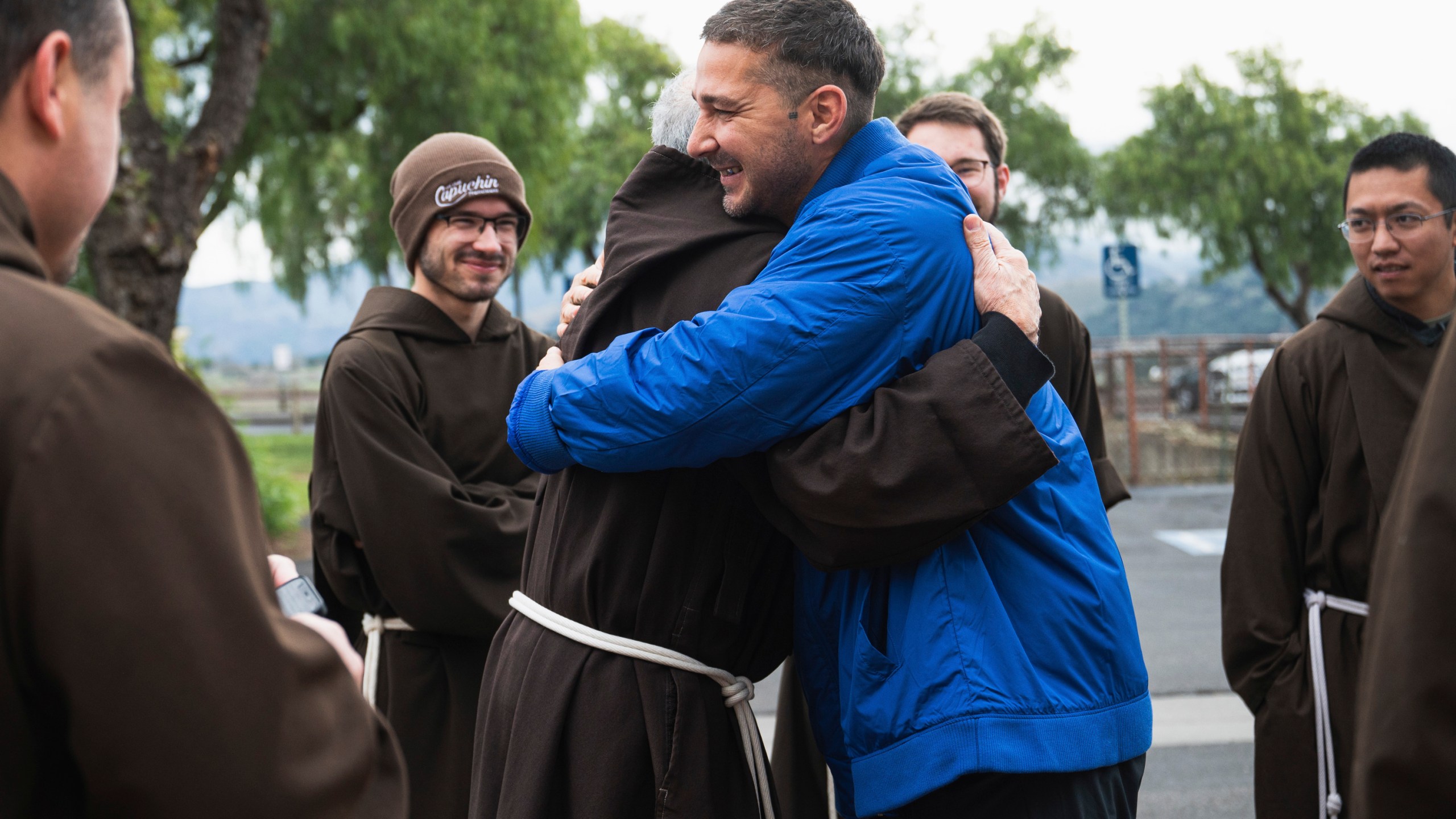 In this photo provided by Word on Fire Catholic Ministries, actor Shia LaBeouf celebrates his Catholic confirmation outside Old Mission Santa Inés Parish in Solvang, Calif., on Sunday, Dec. 31, 2023. “The Capuchin Franciscan friars are overjoyed to welcome him into the fold and witness his deep commitment to his faith journey,” the Catholic religious order said. (Word on Fire Catholic Ministries via AP)
